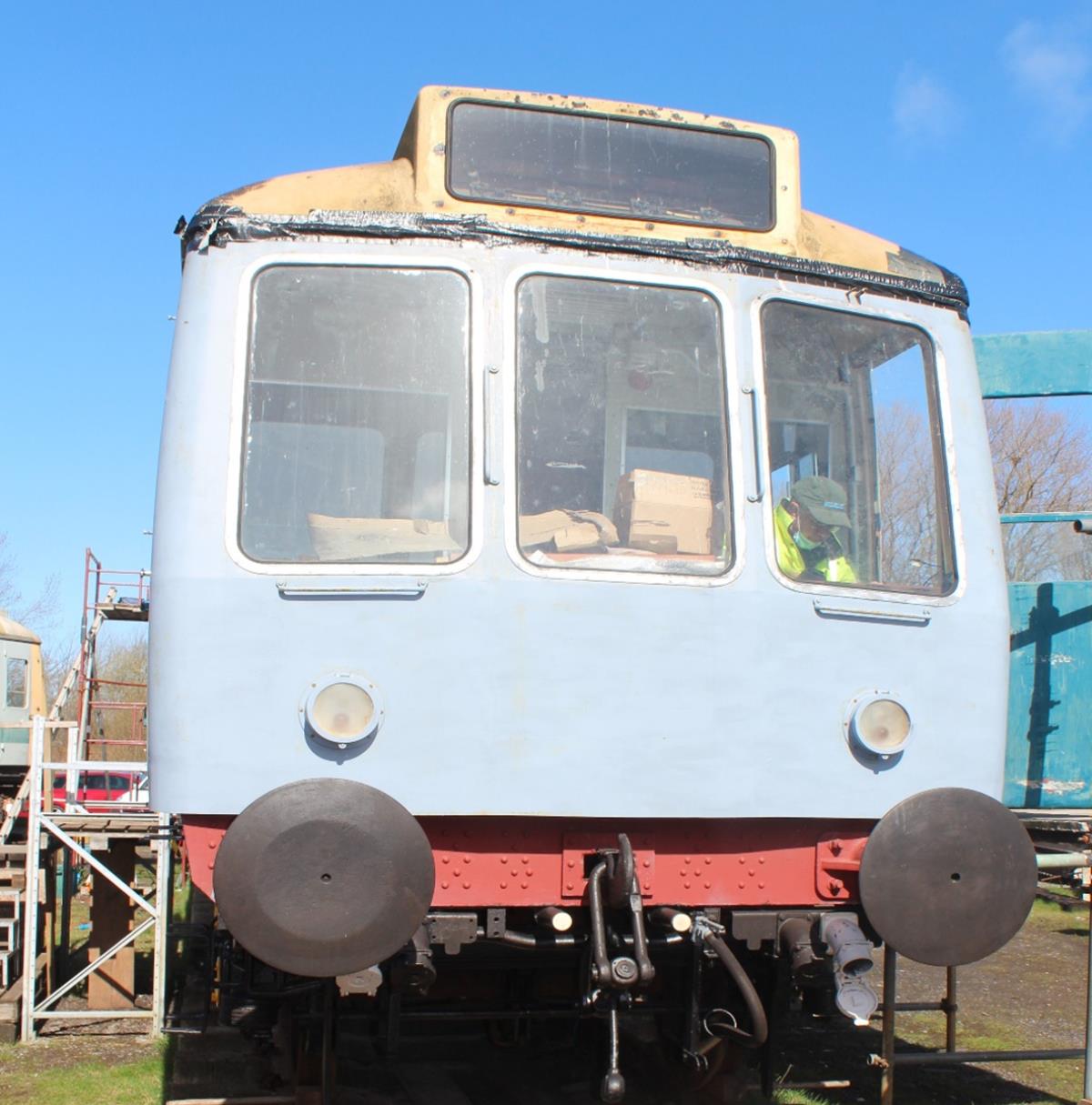 M56484 has had old paint removed from the steelwork and a primer applied.