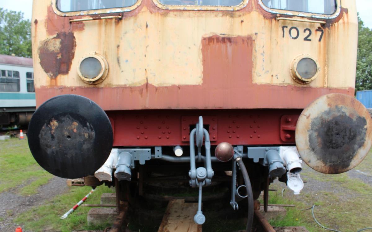 The front buffer beam has been needle gunned to remove surface rust and red oxide primer applied.