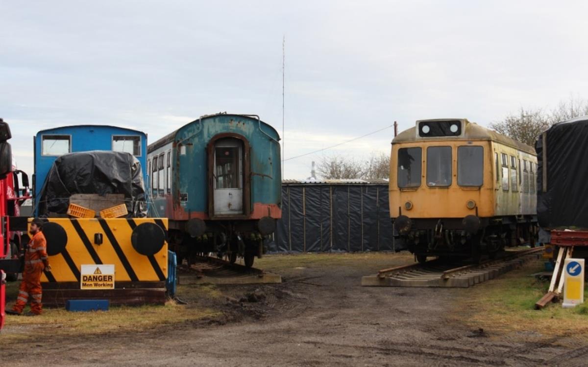 Both DMU carriages on their own lengths of track in the yard